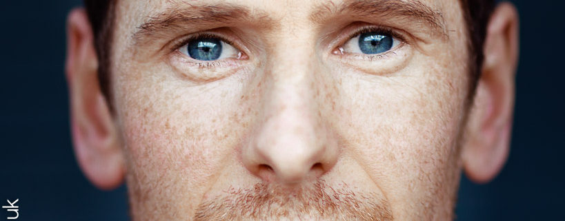 close crop actor headshot featuring actor Gerard kearns with freckles and stunning blue eyes